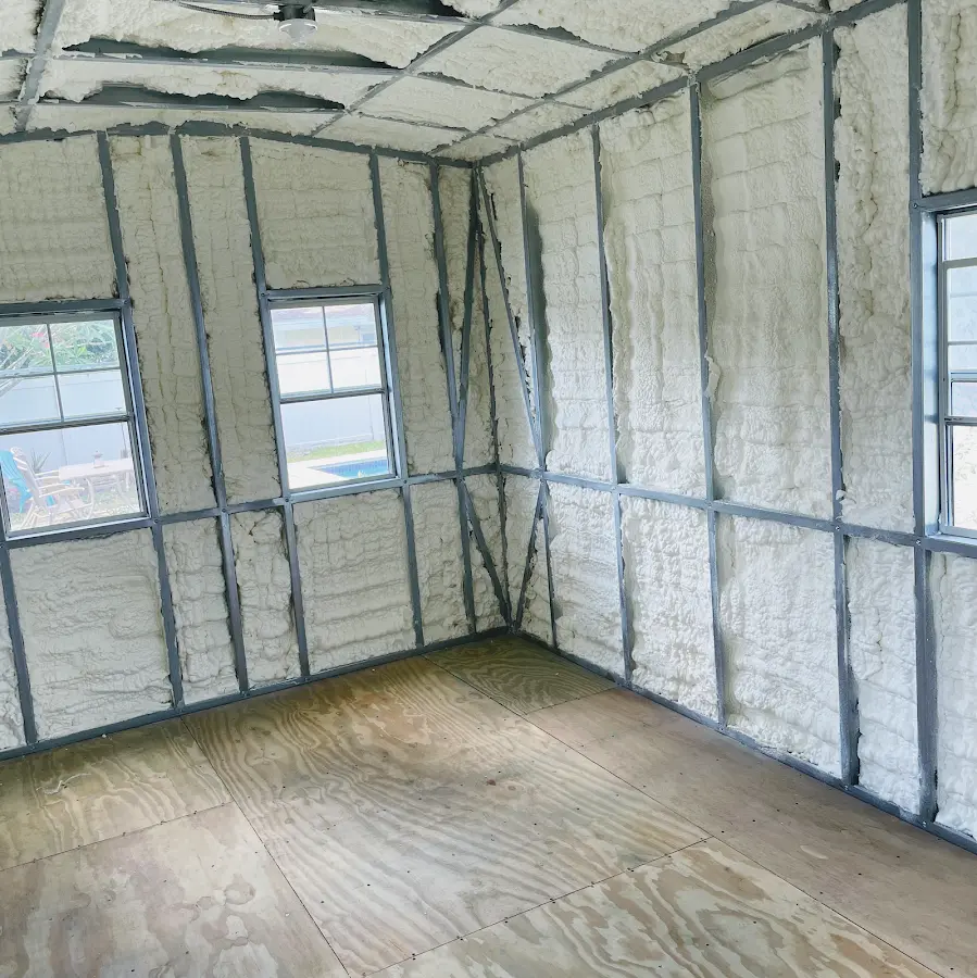 Closed-cell spray foam insulation applied to wall cavities in a residential project in Avenal